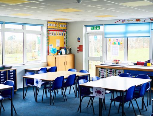 Image of an empty UK primary school classroom.