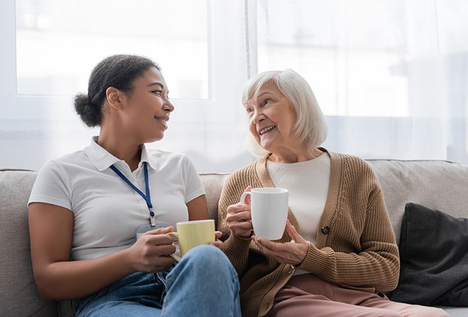 Adult social care worker with an older woman