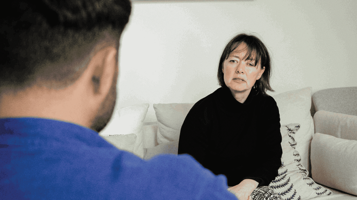 therapist talking to man